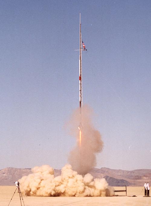 The Deimos Odyssey rocket roars off the launch
tower